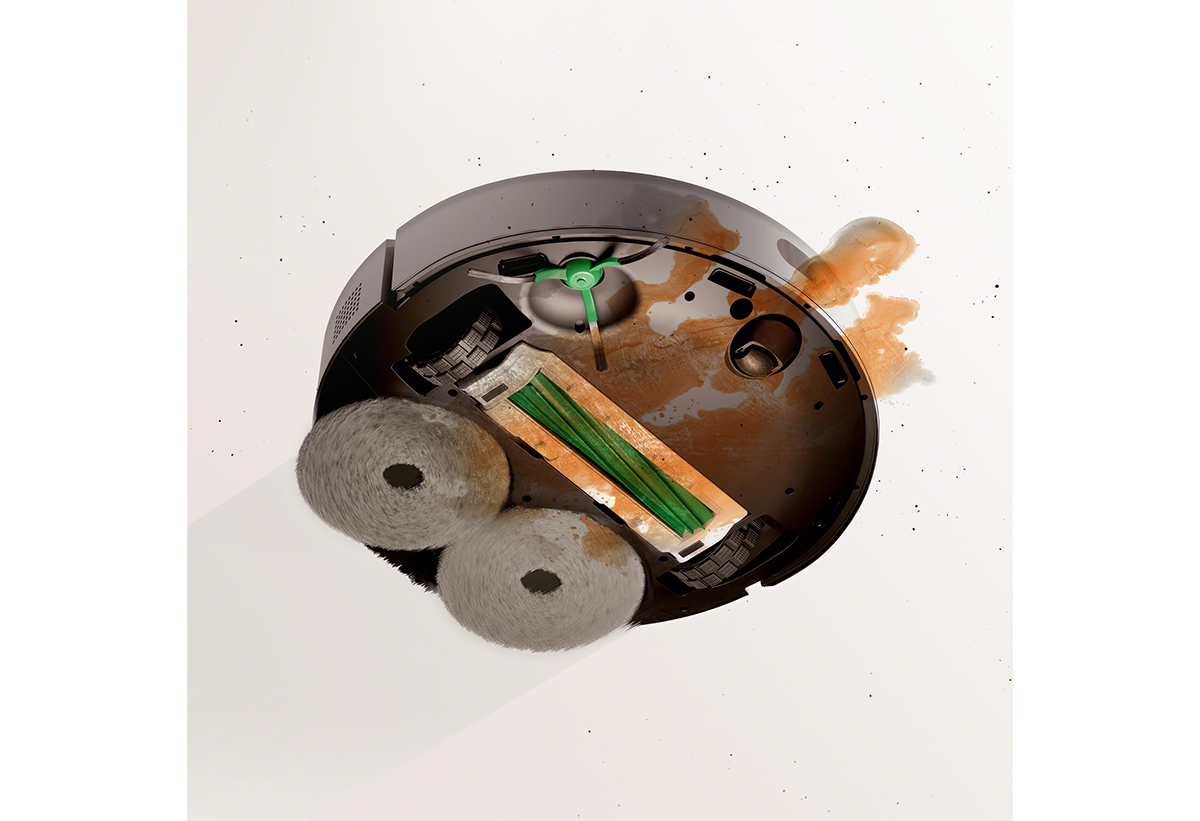 Φαίνεται η σκούπα να αποροφά υγρά και ακαθαρσίες από το πάτωμα.